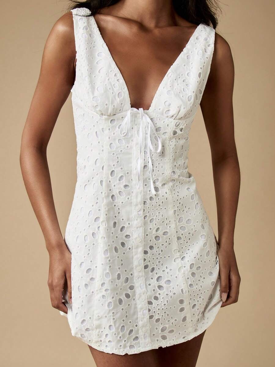 thumbnail image 1 of White Broderie Anglaise Sleeveless Mini Dress With Deep V-Neck And Front Tie Detail, 1 of 6